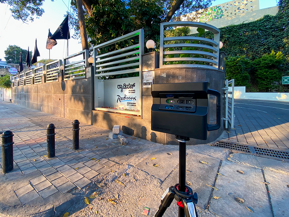 Adostrophe's branding featuring a Matterport camera and digital services.