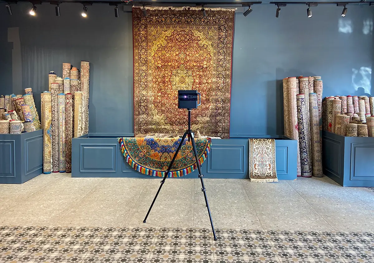 A vibrant, welcoming interior of a local Indian shop, shown in a 360-degree interactive view on a smartphone.