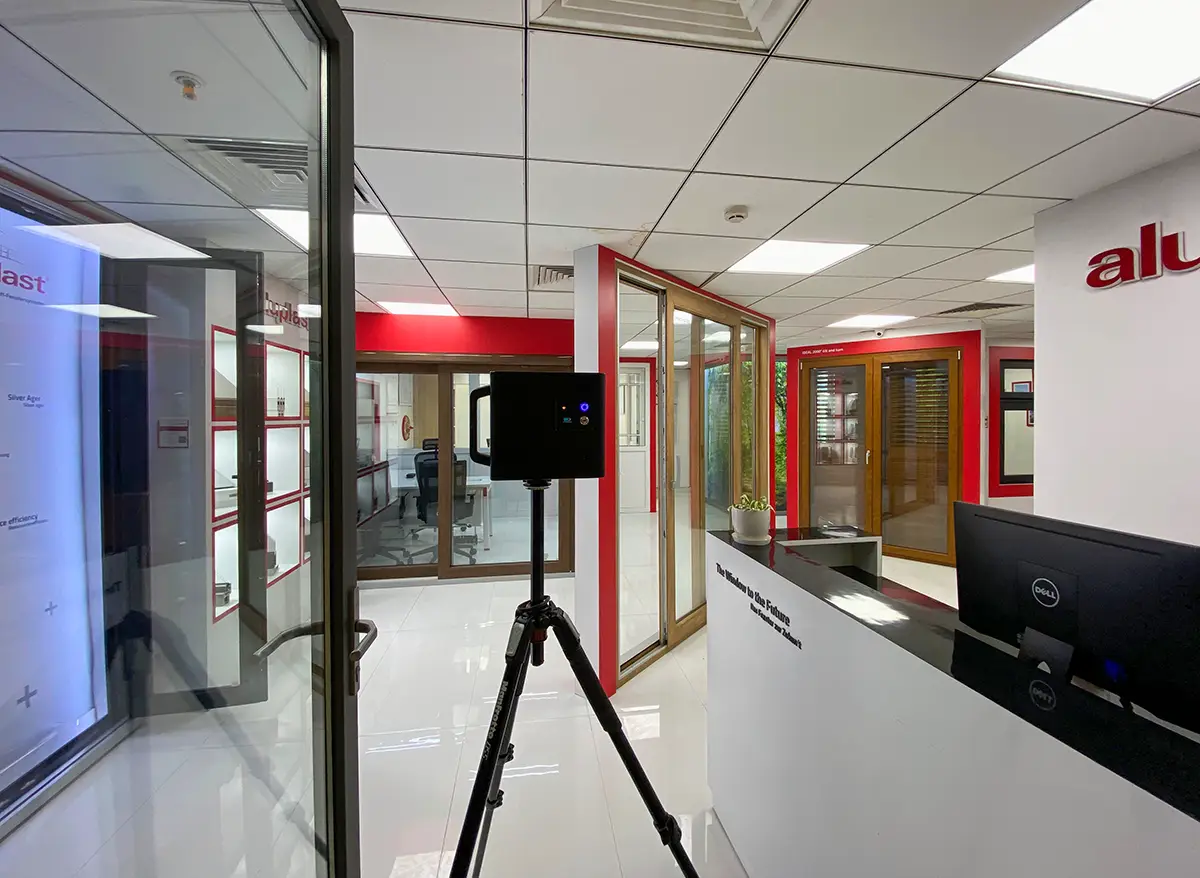 A technician scanning a construction site with a Matterport Pro3 LiDAR camera.