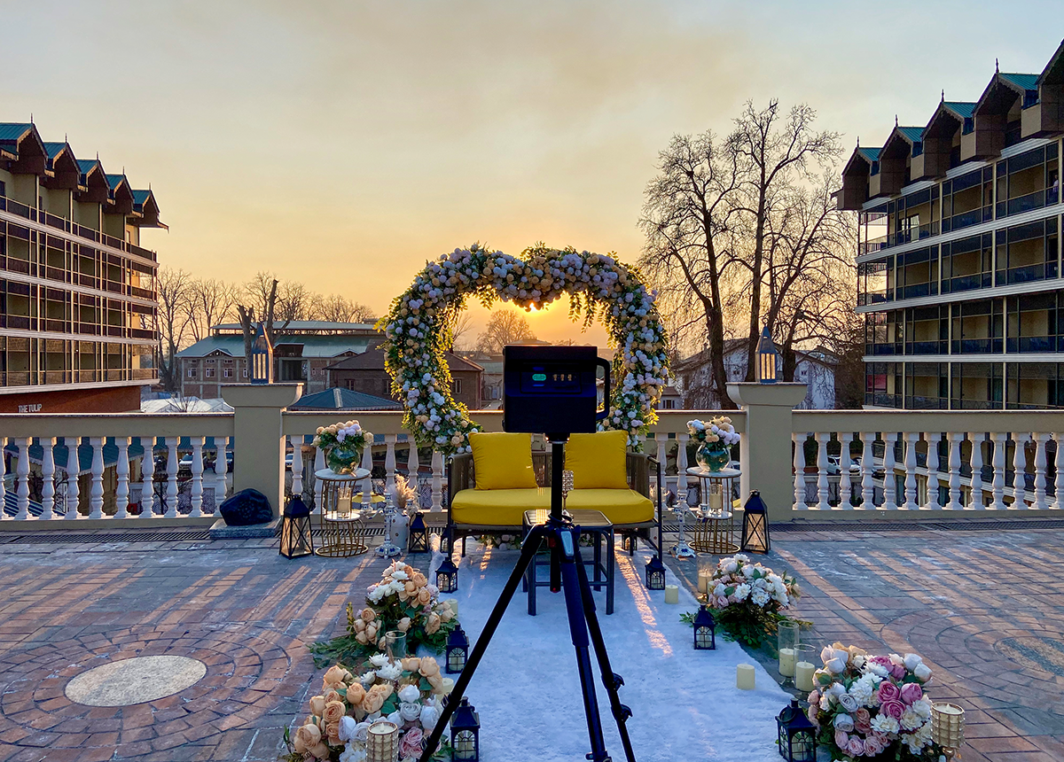 A Matterport Pro2 camera scanning the poolside of a luxury hotel, showcasing digital twin technology.