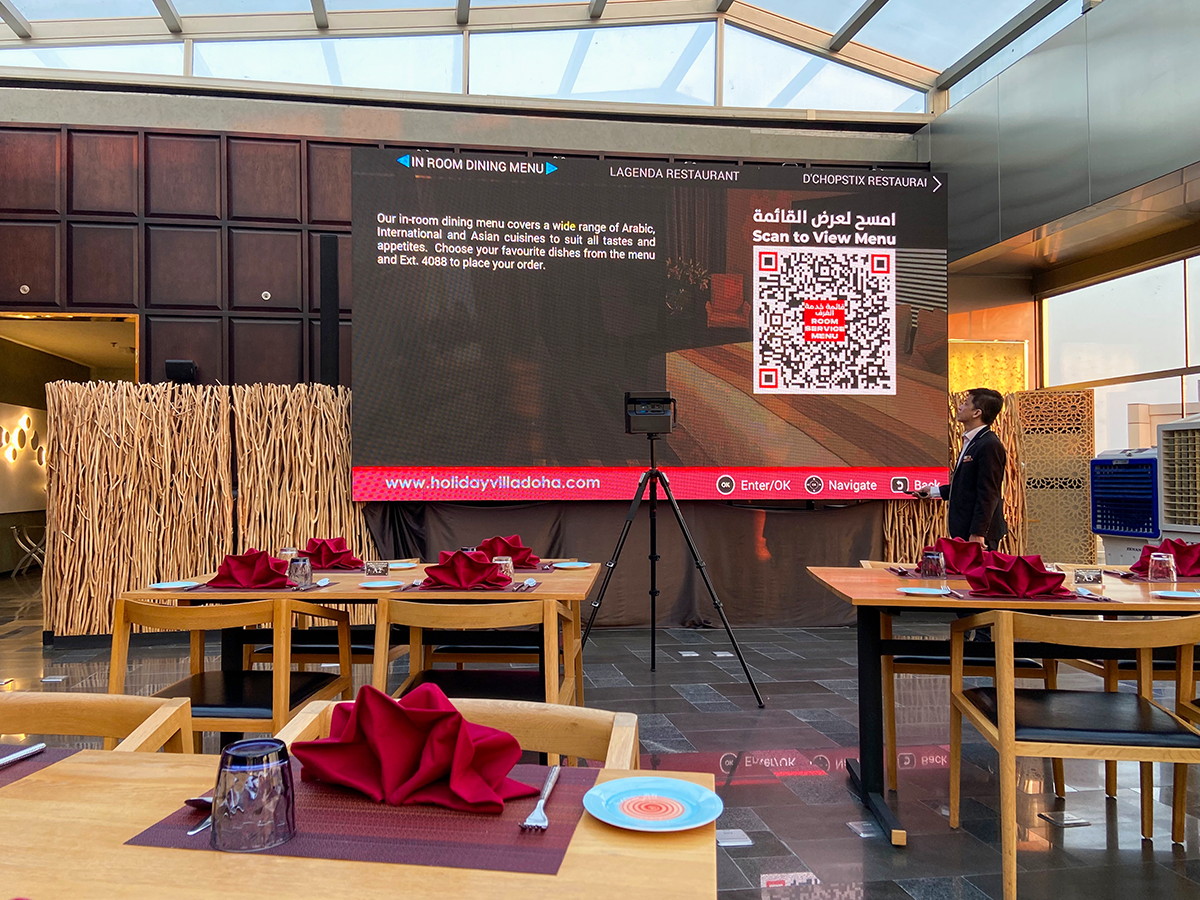 Hotel staff coordinating event setup at Holiday Villa in Doha, Qatar