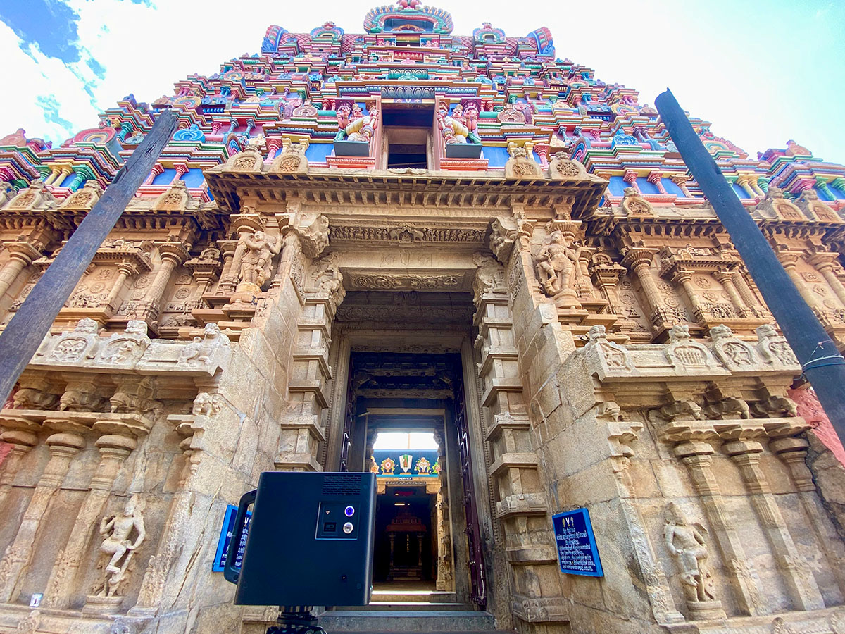 Documenting the intricate architecture of a towering Dravidian Gopuram.