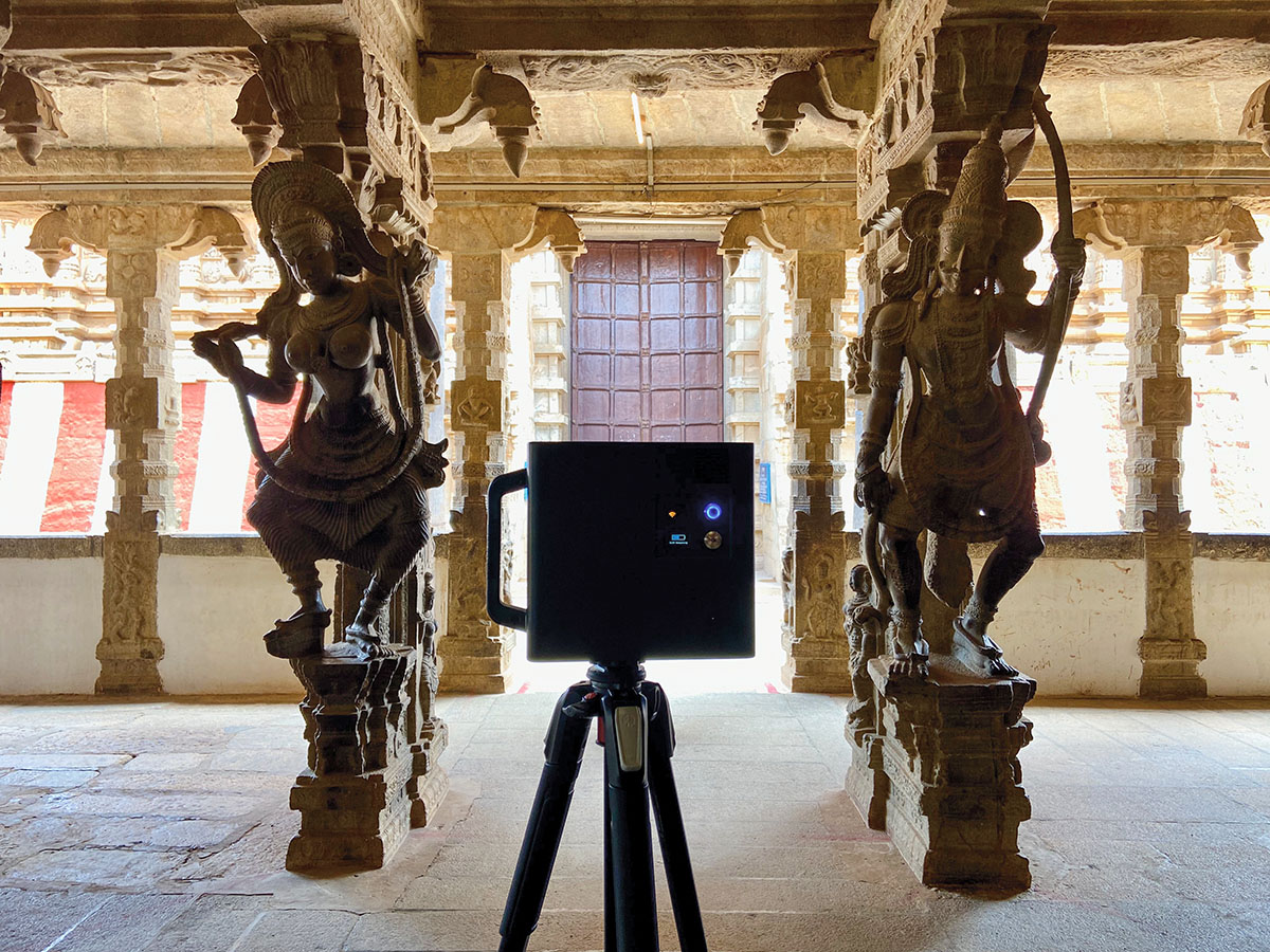 Precise scanner placement between ancient stone sculptures.